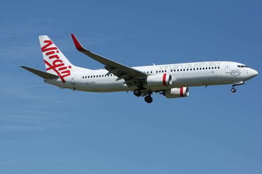 Air travel with a mobility scooter (a photo of a Virgin airliner on final approach to runway.)