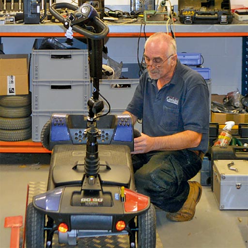A mobility scooter being repaired at our servicing centre.